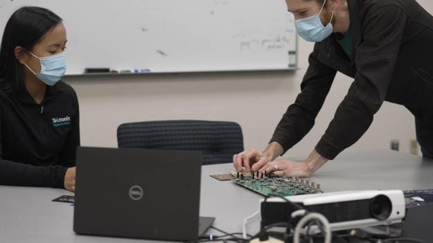 Tektronix engineers working together to develop the 2 Series Mixed Signal Oscilloscope