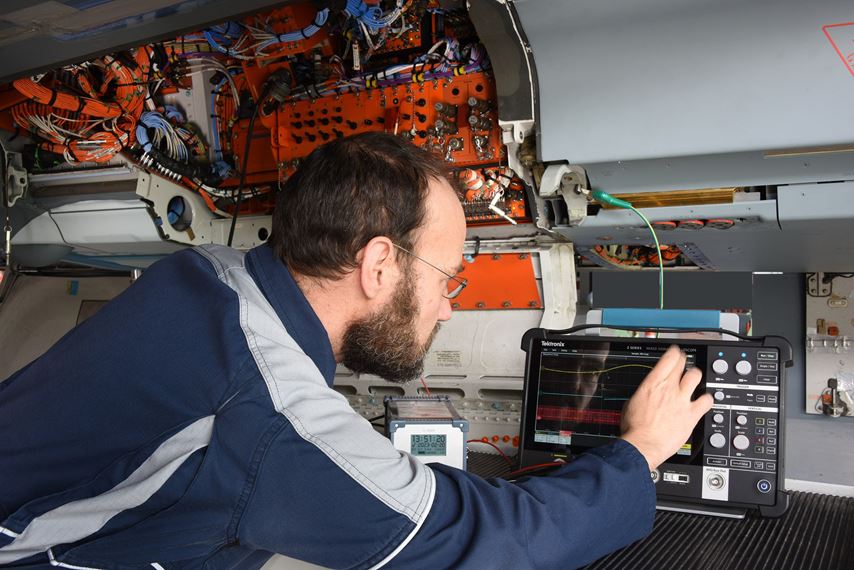 Engineer configuring a 2 Series MSO for an airbus